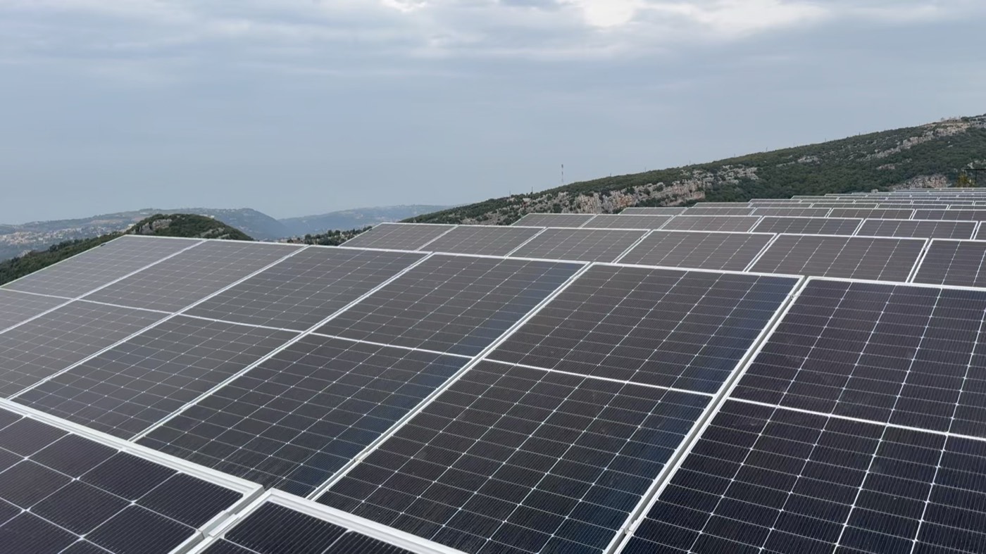 Rows of solar panels at the House of Satoshi farm in the Lebanese hills